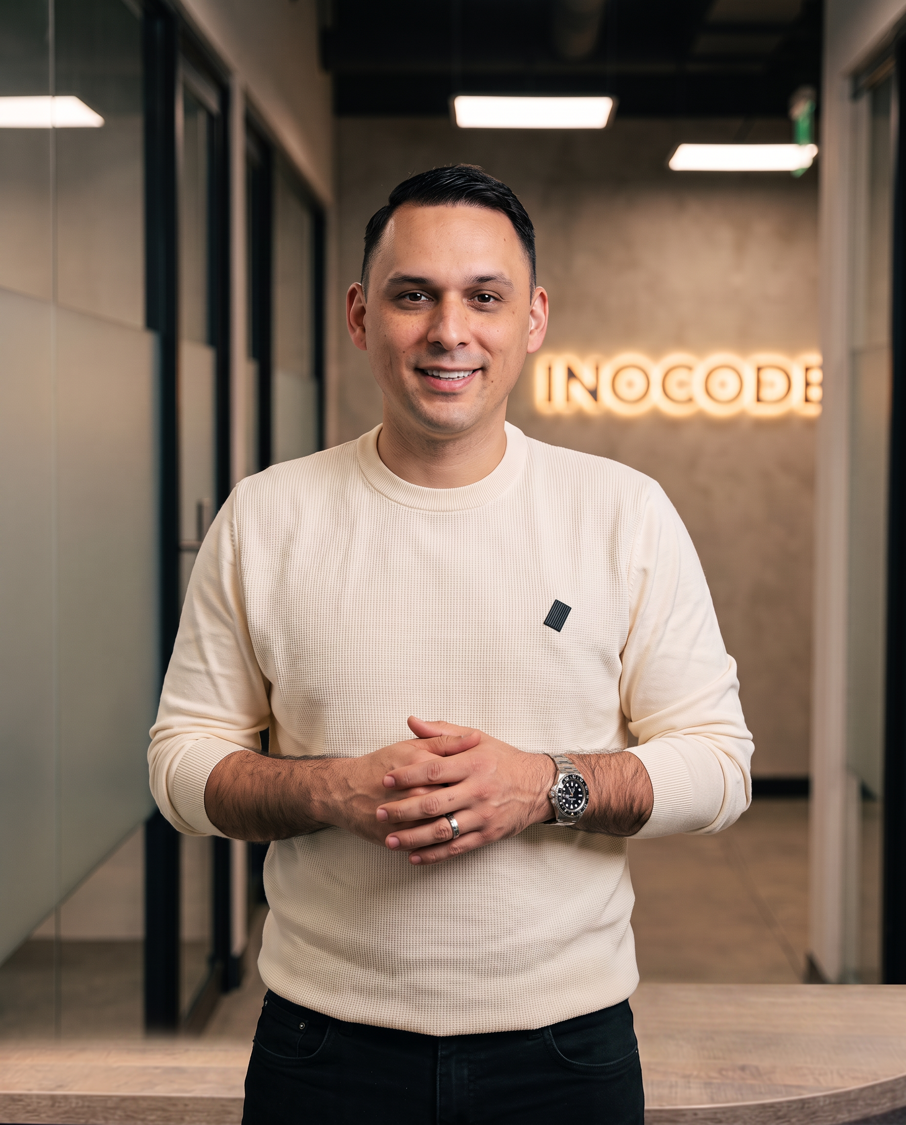 Founder of Inocode, a custom software development agency, standing in the studio office